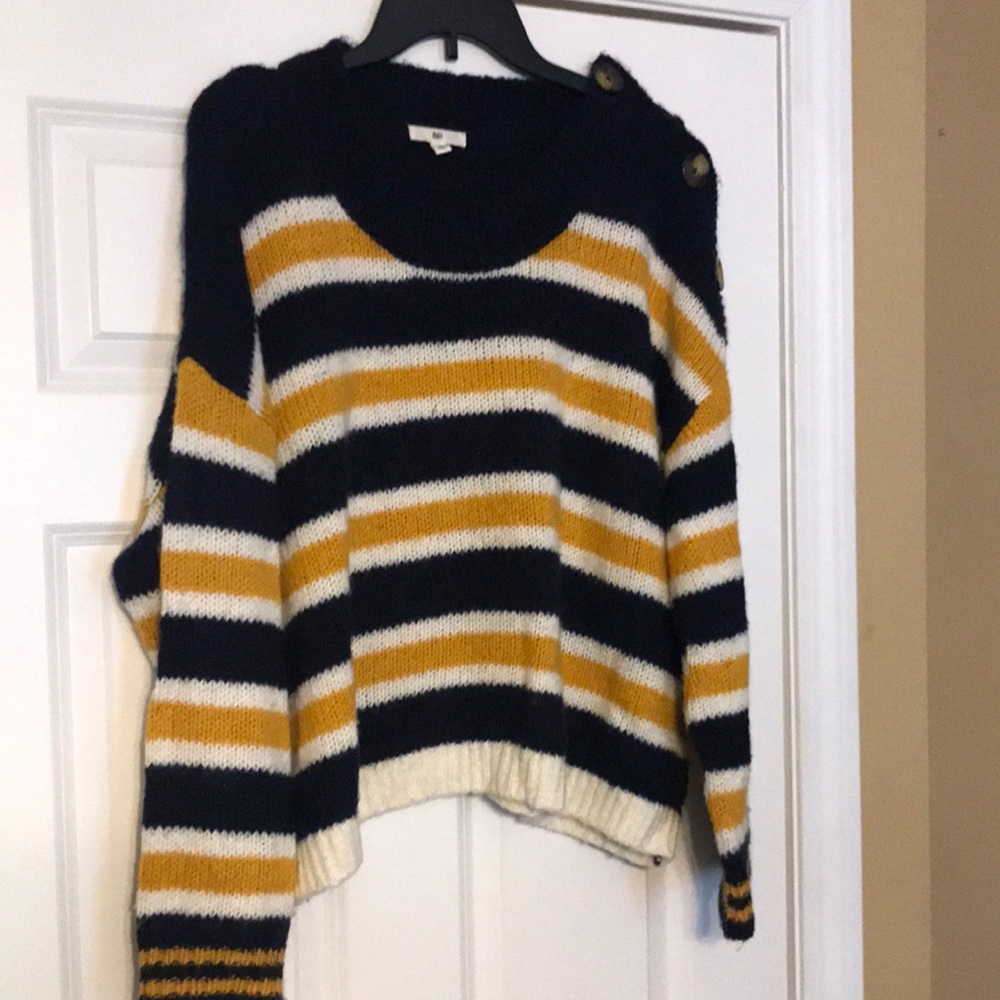 Cropped striped sweater with button accents on left shoulder